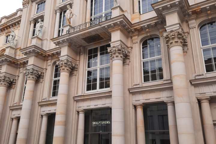 a group of people standing in front of a building
