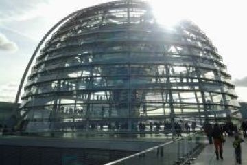 a large building with Reichstag dome in the background